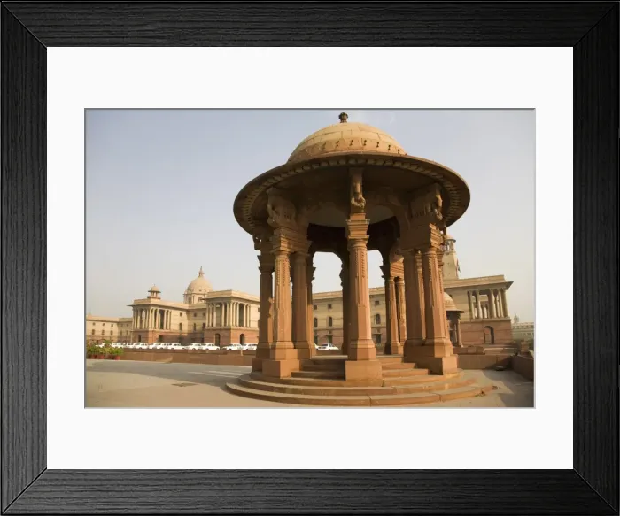 Framed Print : A chhattri stands in front of the Herbert Baker designed North Block Secretariat Building in New Delhi Framed Print : A chhattri stands in front of the Herbert Baker designed North Block Secretariat Building in New Delhi