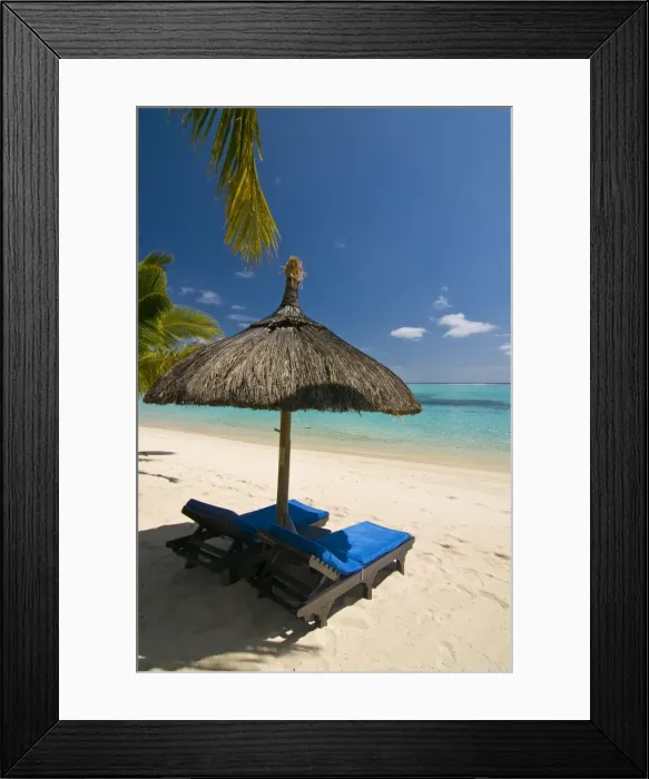 Framed Print : Sun lounger on the beach of the Beachcomber Le Paradis five star hotel