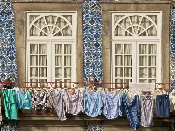 Laundry hanging from window in the Ribeira Quarter, Oporto, Portugal, Europe