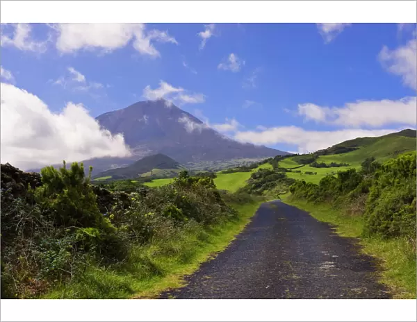 Country road with Mount Pico volcano in background, Pico, Azores, Portugal, Europe