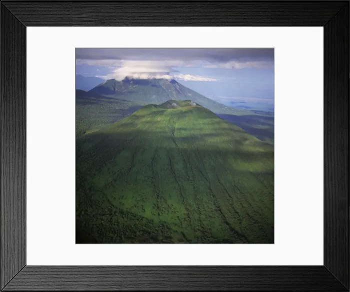Framed Print : Aerial view of Mount Visoke (Mount Bisoke), an extinct volcano, straddling border of Rwanda Framed Print : Aerial view of Mount Visoke (Mount Bisoke), an extinct volcano, straddling border of Rwanda