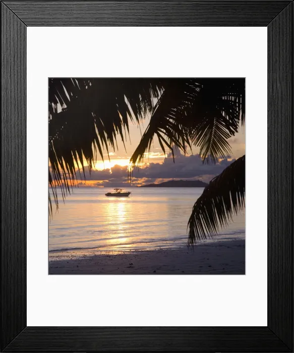 Framed Print : Small boat moored off the beach at Anse Volbert at sunrise, Baie Sainte Anne district Framed Print : Small boat moored off the beach at Anse Volbert at sunrise, Baie Sainte Anne district