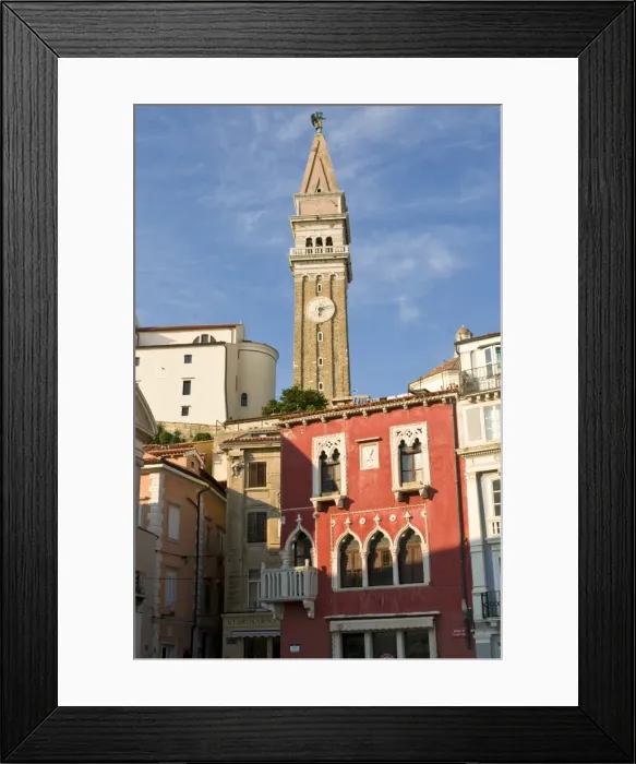 Framed Print : Free standing bell tower of Cathedral of St. Georges between houses, Piran Framed Print : Free standing bell tower of Cathedral of St. Georges between houses, Piran