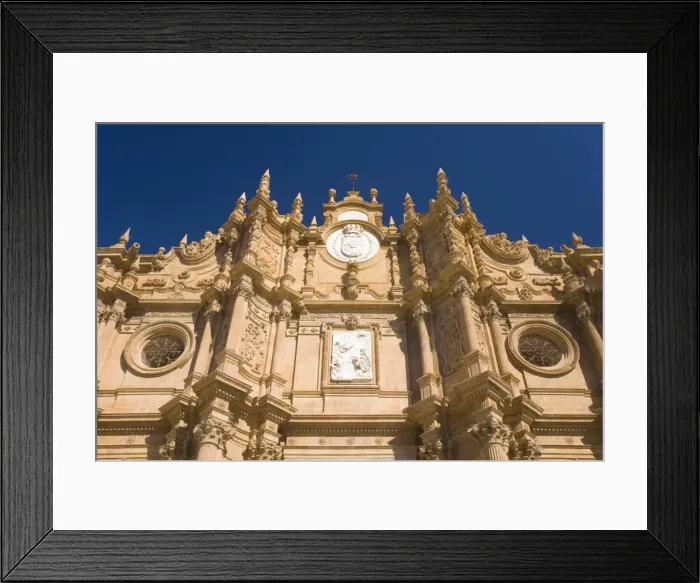 Framed Print : View from below of richly decorated facade of the cathedral, Guadix, Granada Framed Print : View from below of richly decorated facade of the cathedral, Guadix, Granada