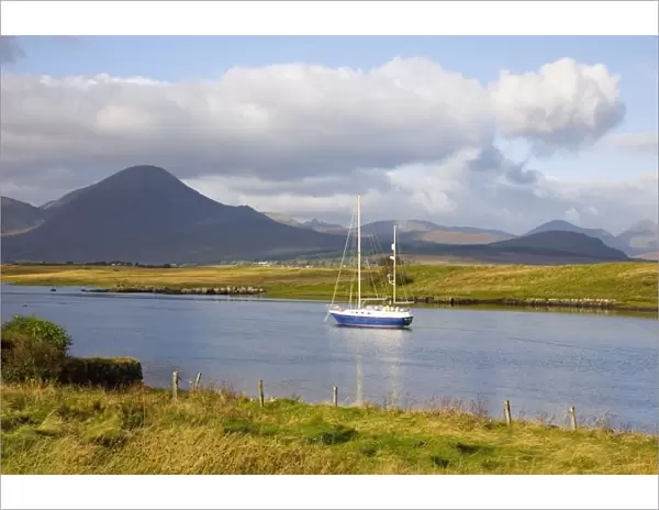 Yacht moored in inlet at Lower Breakish, near Broadford, Isle of Skye, Highland
