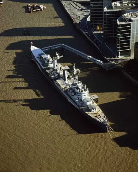 Aerial image of HMS Belfast, a Royal Navy Town-class cruiser, on the River Thames
