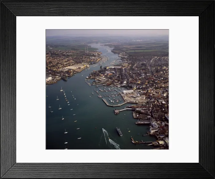 Framed Print : Aerial image of Cowes, on the west bank of the estuary of the River Medina facing the smaller town of East Cowes on the east bank, Isle of Wight. England, United Framed Print : Aerial image of Cowes, on the west bank of the estuary of the River Medina facing the smaller town of East Cowes on the east bank, Isle of Wight. England, United