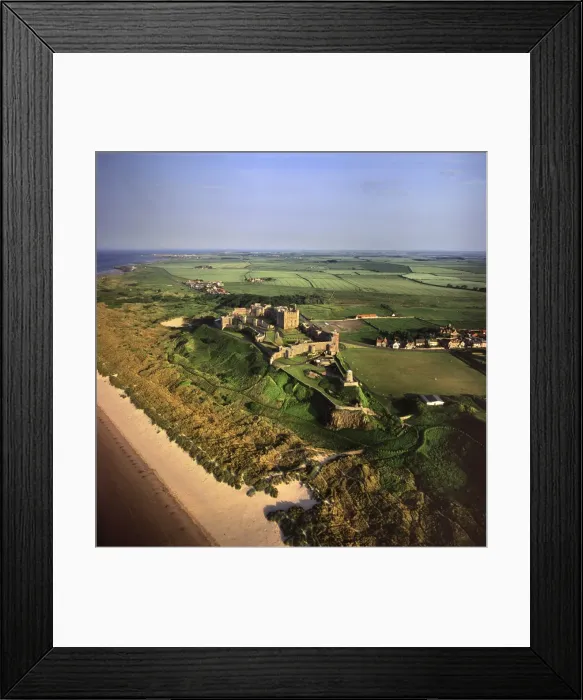 Framed Print : Aerial image of Bamburgh Castle, a Norman castle built on a basalt outcrop on the coast Framed Print : Aerial image of Bamburgh Castle, a Norman castle built on a basalt outcrop on the coast