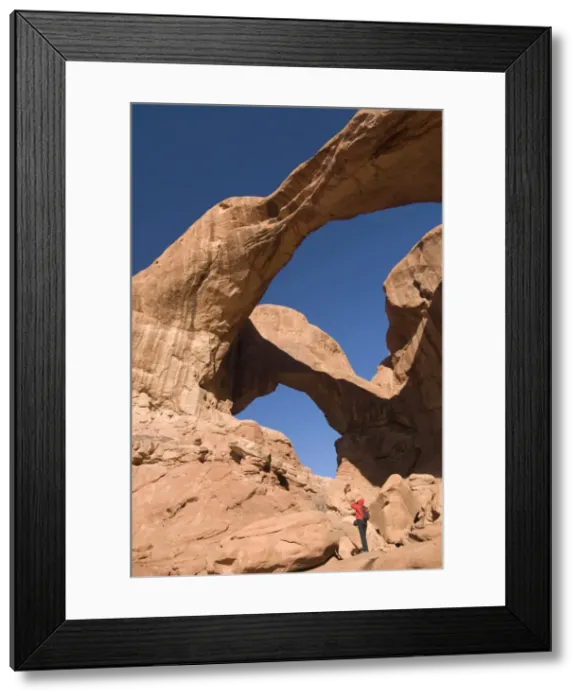 Framed Print : Double Arch and tourist taking a photograph, Arches National Park, Utah Framed Print : Double Arch and tourist taking a photograph, Arches National Park, Utah