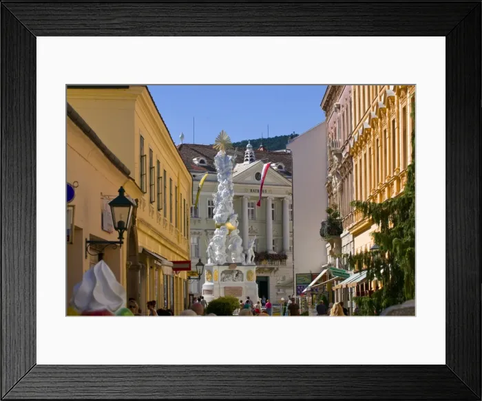 Framed Print : The Trinity Column dating from 1714 and people walking around Hauptplatz surrounded by 18th century buildings, Baden Framed Print : The Trinity Column dating from 1714 and people walking around Hauptplatz surrounded by 18th century buildings, Baden