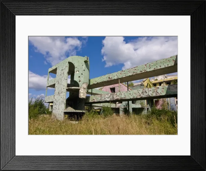 Framed Print : Destroyed old house full of bullet holes in the former war zone of Sarajevo Framed Print : Destroyed old house full of bullet holes in the former war zone of Sarajevo