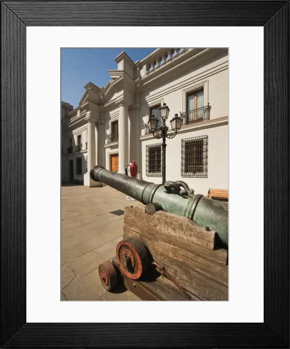 Framed Print : Cannon and modern art on display in an inner courtyard of the Palacio de La Moneda Framed Print : Cannon and modern art on display in an inner courtyard of the Palacio de La Moneda