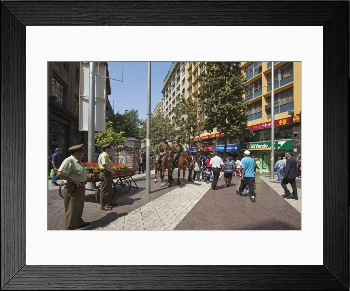 Framed Print : Police on horseback and people on pedestrianised Paseo Huerfanos in the heart of the commercial centre, Santiago, Chile Framed Print : Police on horseback and people on pedestrianised Paseo Huerfanos in the heart of the commercial centre, Santiago, Chile