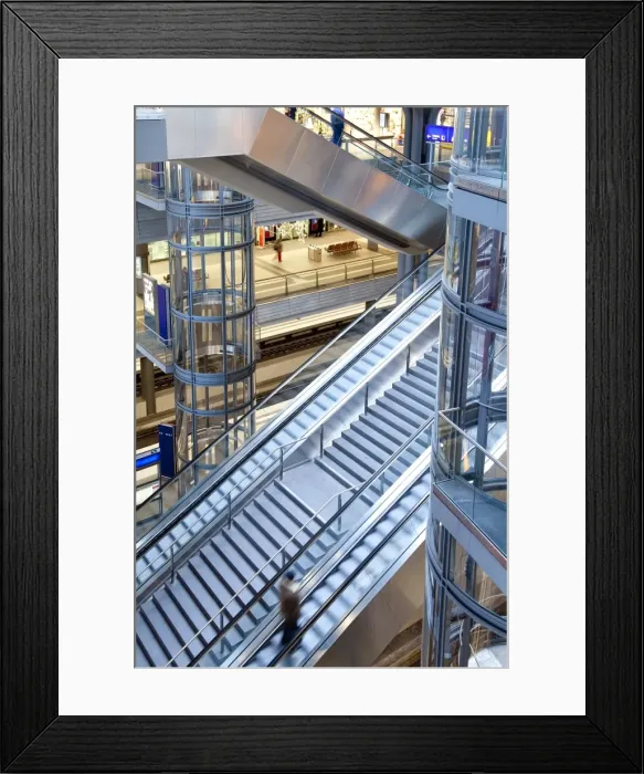 Framed Print : Staircase and escalators leading to the platform in modern train station Framed Print : Staircase and escalators leading to the platform in modern train station