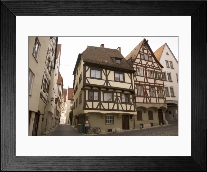 Framed Print : Historic half-timbered houses typical of the city stand close to the Meztgerturm in Ulm Framed Print : Historic half-timbered houses typical of the city stand close to the Meztgerturm in Ulm