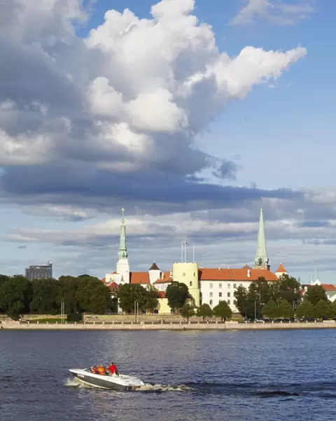 Speedboat on Daugava River with Riga Castle in background, Riga, Latvia