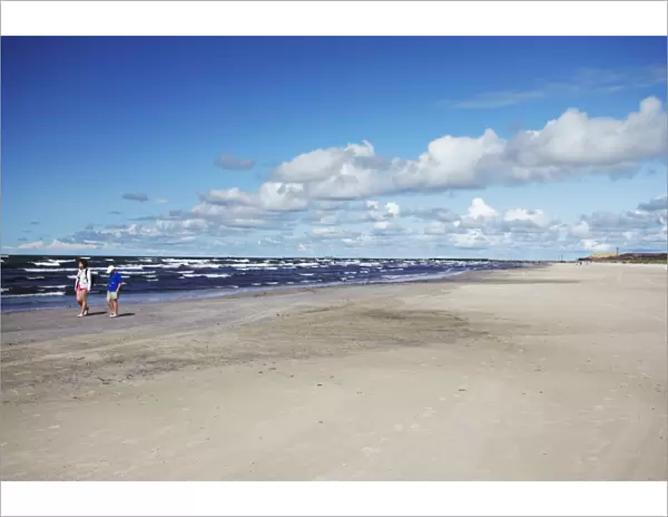 People walking on Blue Flag Beach, Liepaja, Western Latvia, Latvia, Baltic States, Europe