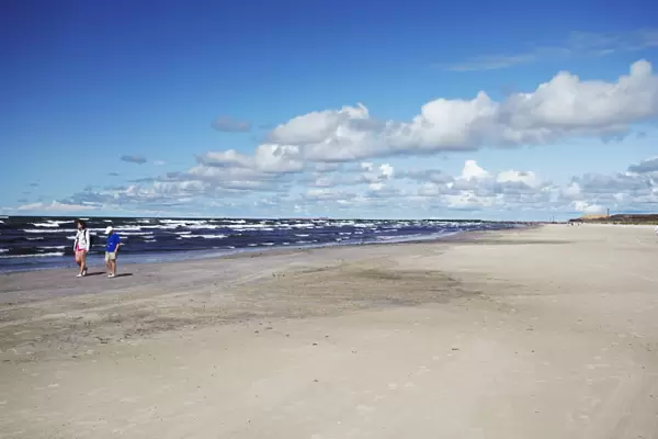 People walking on Blue Flag Beach, Liepaja, Western Latvia, Latvia, Baltic States, Europe