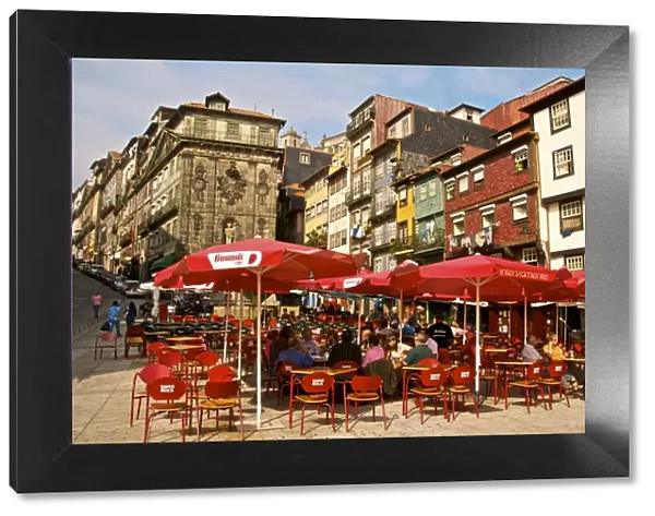 Red sunshades of cafes in Ribeira Square, Porto, Portugal, Europe