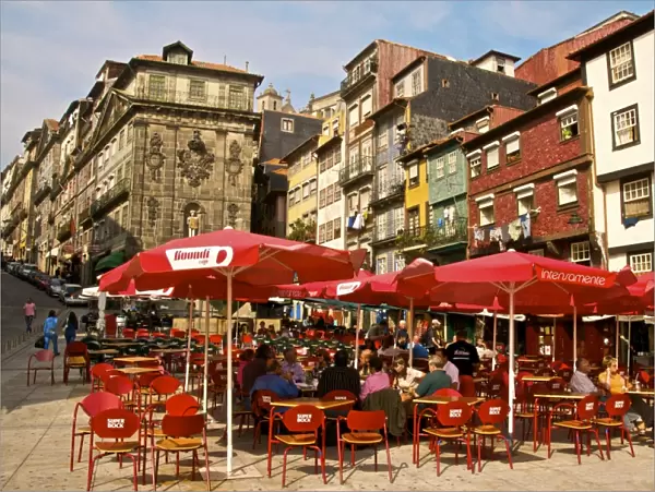 Red sunshades of cafes in Ribeira Square, Porto, Portugal, Europe