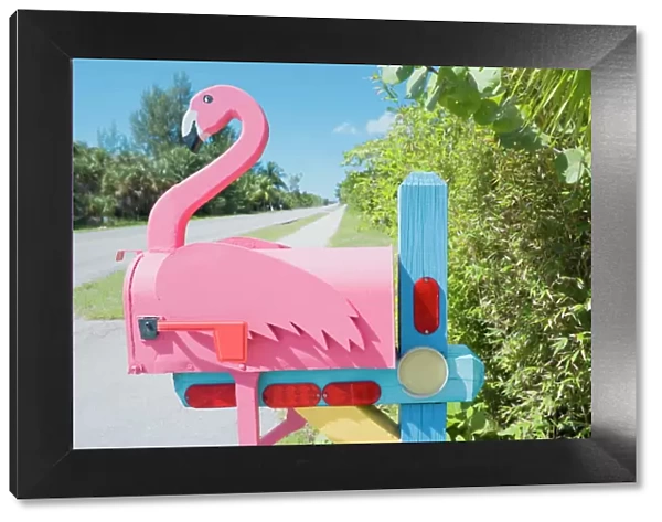 Flamingo made of wood attached to pink mailbox, Sanibel Island, Florida