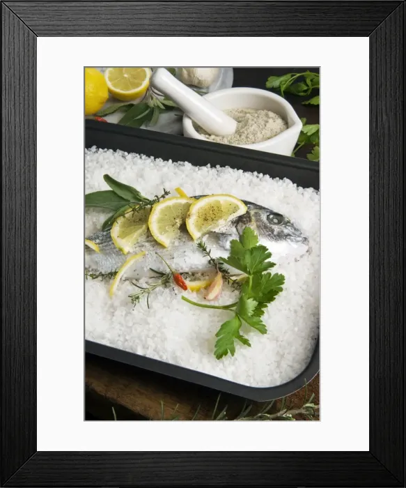 Framed Print : Preparing gilthead bream in salt coating Framed Print : Preparing gilthead bream in salt coating