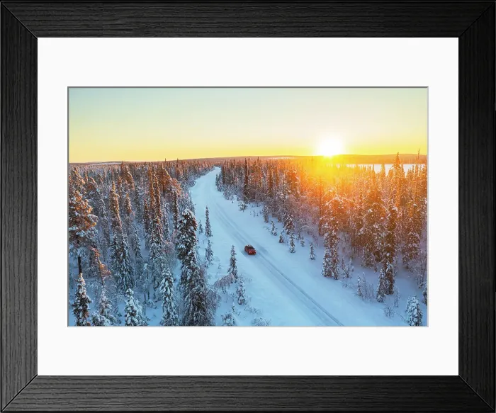 Framed Print : Car travels the icy and empty road crossing the boreal snowy forest at sunrise, Swedish Lapland, Sweden, Scandinavia, Europe Framed Print : Car travels the icy and empty road crossing the boreal snowy forest at sunrise, Swedish Lapland, Sweden, Scandinavia, Europe