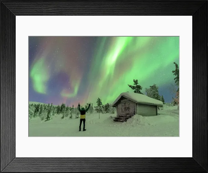 Framed Print : Happy tourist waving at the Northern Lights (Aurora Borealis) dancing in the night sky above the Arctic Circle, Akaslompolo, Kolari municipality, Finland, Europe Framed Print : Happy tourist waving at the Northern Lights (Aurora Borealis) dancing in the night sky above the Arctic Circle, Akaslompolo, Kolari municipality, Finland, Europe