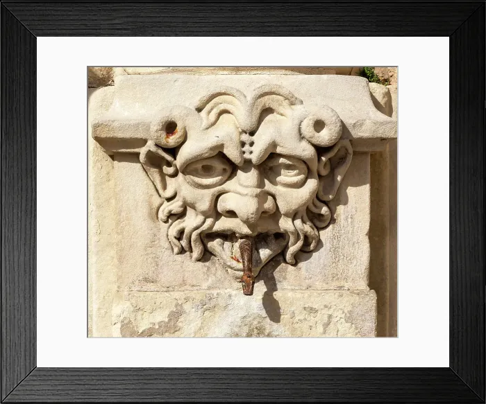 Framed Print : Carved stone face with snake spout emerging from mouth, on old fountain in Cuenca, Castille La Mancha, Spain, Europe Framed Print : Carved stone face with snake spout emerging from mouth, on old fountain in Cuenca, Castille La Mancha, Spain, Europe