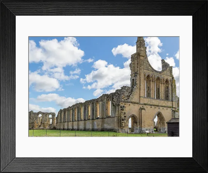 Framed Print : Ancient ruins of a Gothic abbey with arches under a blue sky with clouds at Byland Abbey, North Yorkshire, England, United Kingdom, Europe Framed Print : Ancient ruins of a Gothic abbey with arches under a blue sky with clouds at Byland Abbey, North Yorkshire, England, United Kingdom, Europe