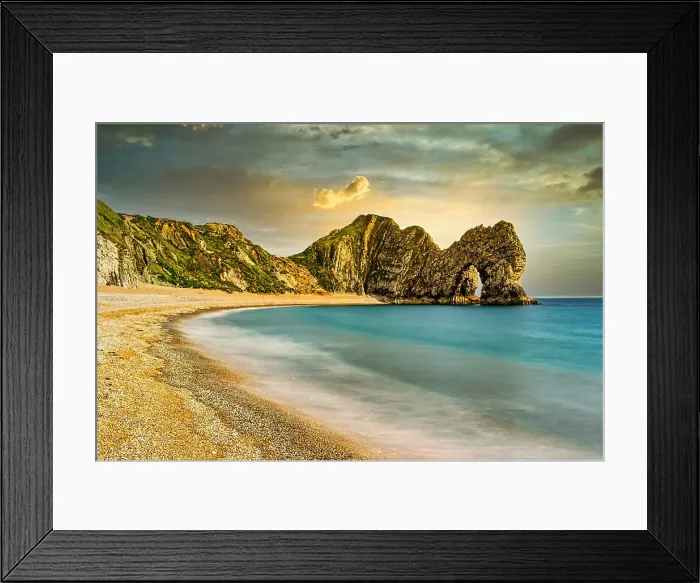 Framed Print : Serene beach with smooth waters, golden sand, and rugged cliffs under a sunset sky at Durdle Door, Jurassic Coast, UNESCO World Heritage Site, Dorset, England, United Kingdom, Europe