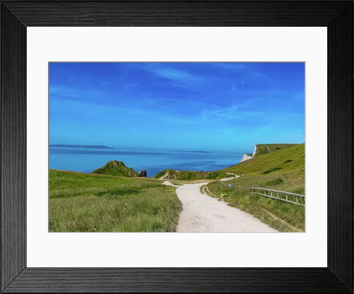 Framed Print : Coastal pathway with lush grass, blue sky, and calm sea, ideal for travel and nature themes at Durdle Door, Jurassic Coast, UNESCO World Heritage Site, Dorset, England, United Kingdom, Europe Framed Print : Coastal pathway with lush grass, blue sky, and calm sea, ideal for travel and nature themes at Durdle Door, Jurassic Coast, UNESCO World Heritage Site, Dorset, England, United Kingdom, Europe