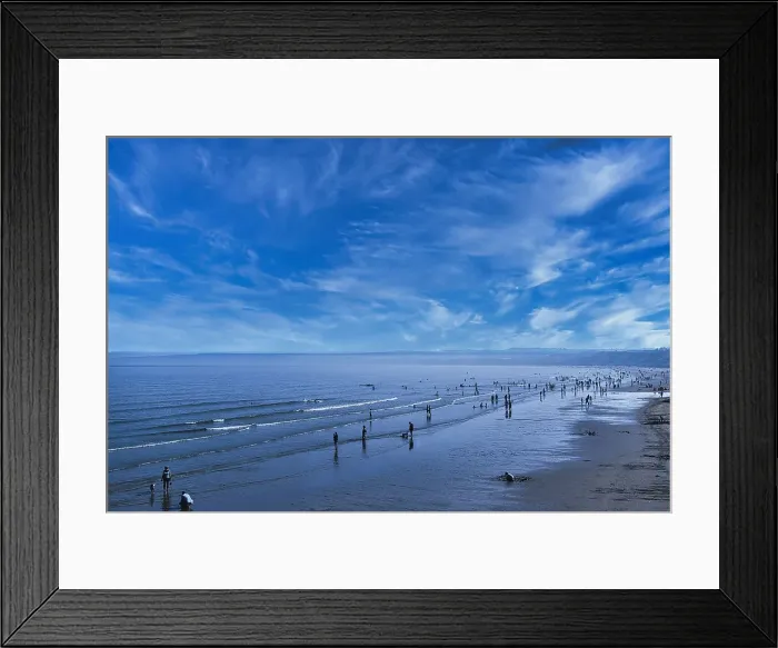 Framed Print : Scenic view of a tranquil beach with people strolling and the vast ocean meeting a blue sky with wispy clouds in Filey, England Framed Print : Scenic view of a tranquil beach with people strolling and the vast ocean meeting a blue sky with wispy clouds in Filey, England