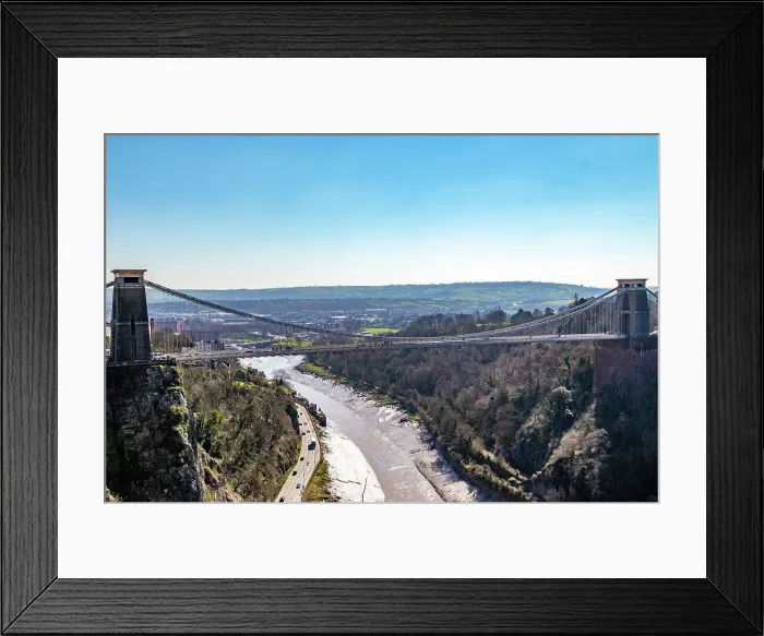Framed Print : Cifton Suspension Bridge over a scenic gorge with a river, under a clear blue sky in Bristol, England, United Kingdom, Europe Framed Print : Cifton Suspension Bridge over a scenic gorge with a river, under a clear blue sky in Bristol, England, United Kingdom, Europe