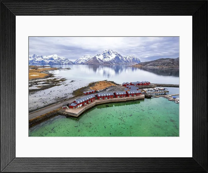 Framed Print : Aerial view of traditional red rorbu surrounded by majestic mountains covered with snow, Vestvagoy, Lofoten Islands, Norway, Scandinavia, Europe
