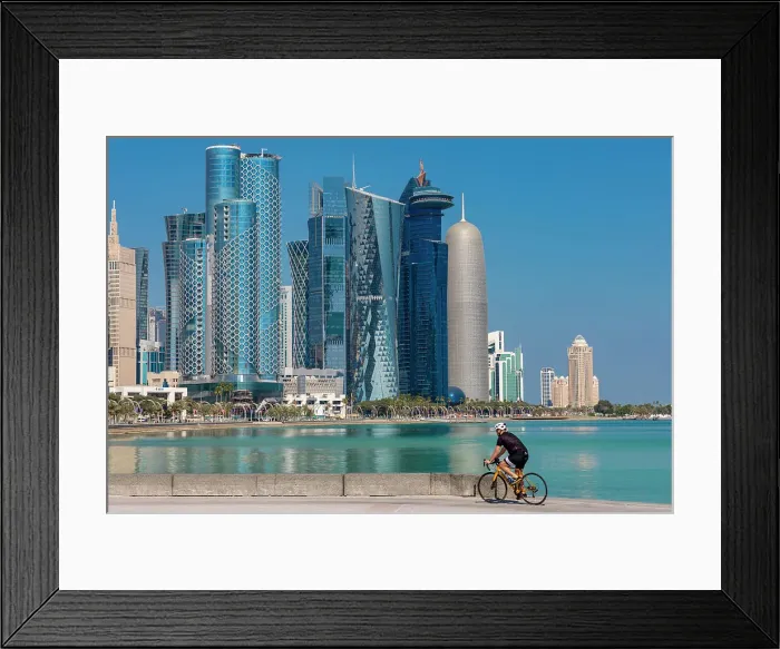 Framed Print : A Cyclist against the West Bay Skyline, Doha, Qatar, Middle East Framed Print : A Cyclist against the West Bay Skyline, Doha, Qatar, Middle East