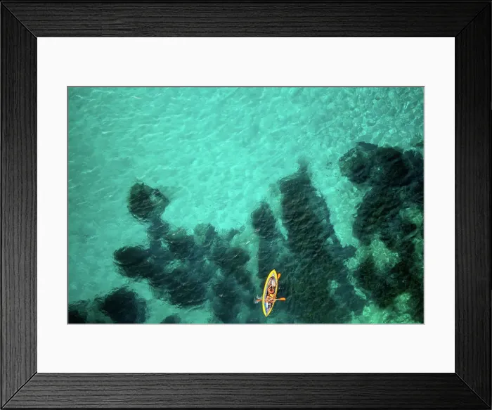 Framed Print : Aerial drone above view of a kayak on the turquoise water of Mediterranean Sea, Sardinia, Italy, Mediterranean, Europe Framed Print : Aerial drone above view of a kayak on the turquoise water of Mediterranean Sea, Sardinia, Italy, Mediterranean, Europe