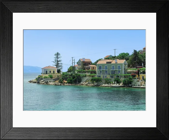 Framed Print : Fiscardo village of low rise houses with red tiled rooftops by a beach with bathers, Fiscardo, Kefalonia, Ionian Island, Greek Islands, Greece, Europe Framed Print : Fiscardo village of low rise houses with red tiled rooftops by a beach with bathers, Fiscardo, Kefalonia, Ionian Island, Greek Islands, Greece, Europe