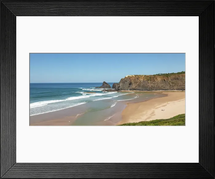 Framed Print : Coastline view of headlands and bay with wide sandy beach, surfer and a few sunbathers, Praia de Odeceixe, Algarve, Portugal, Europe Framed Print : Coastline view of headlands and bay with wide sandy beach, surfer and a few sunbathers, Praia de Odeceixe, Algarve, Portugal, Europe