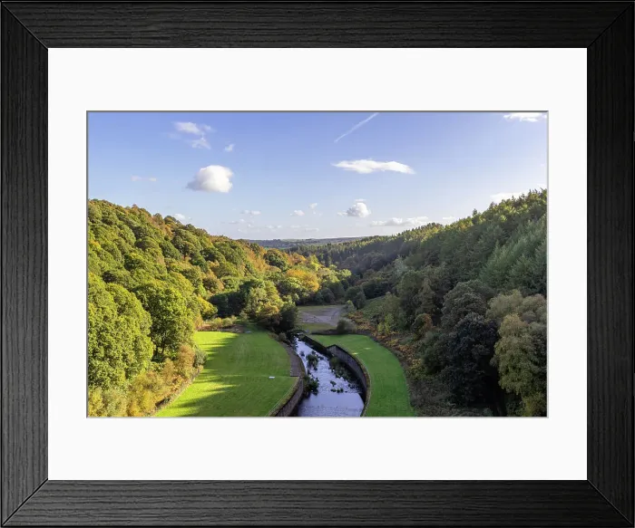 Framed Print : Scenic view of a lush valley with a winding river, surrounded by dense forests under a clear sky at Thruscross Reservoir in North Yorkshire, England, United Kingdom, Europe Framed Print : Scenic view of a lush valley with a winding river, surrounded by dense forests under a clear sky at Thruscross Reservoir in North Yorkshire, England, United Kingdom, Europe