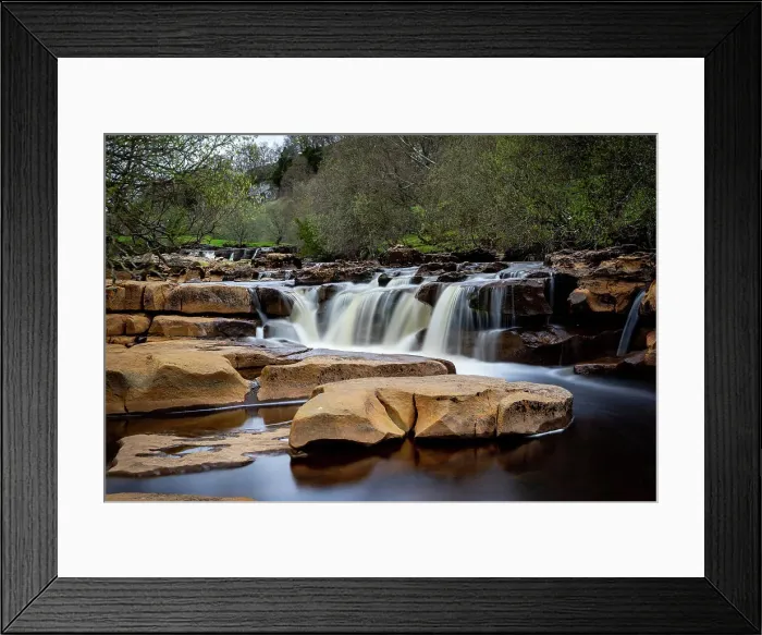 Framed Print : Serene waterfall cascading over rocks with lush greenery in the background, showcasing nature's tranquility, North Yorkshire, England, United Kingdom, Europe Framed Print : Serene waterfall cascading over rocks with lush greenery in the background, showcasing nature's tranquility, North Yorkshire, England, United Kingdom, Europe