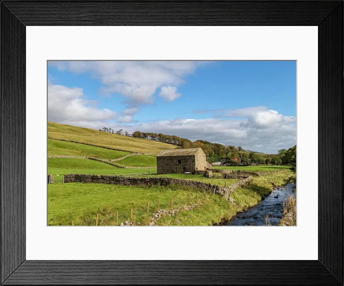Framed Print : Idyllic countryside landscape with a stone barn, green fields, and a clear stream under a blue sky with fluffy clouds, North Yorkshire, England, United Kingdom, Europe
