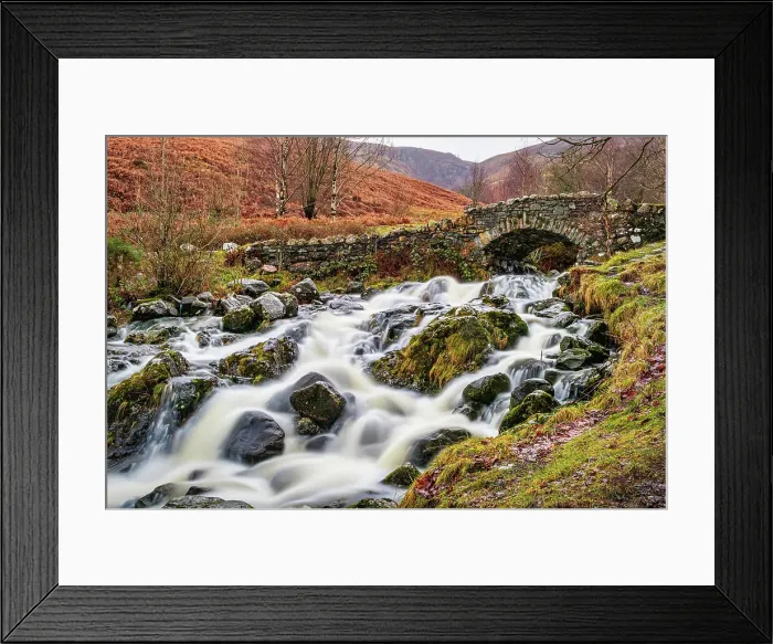 Framed Print : Rustic stone bridge over a flowing stream with mossy rocks in a lush, green landscape in the Lake District, Cumbria, England, United Kingdom, Europe Framed Print : Rustic stone bridge over a flowing stream with mossy rocks in a lush, green landscape in the Lake District, Cumbria, England, United Kingdom, Europe