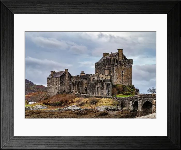 Framed Print : Majestic medieval castle with stone bridge over a river, surrounded by wild nature under a cloudy sky, Eilean Donan, Dornie, Scotland, United Kingdom, Europe Framed Print : Majestic medieval castle with stone bridge over a river, surrounded by wild nature under a cloudy sky, Eilean Donan, Dornie, Scotland, United Kingdom, Europe