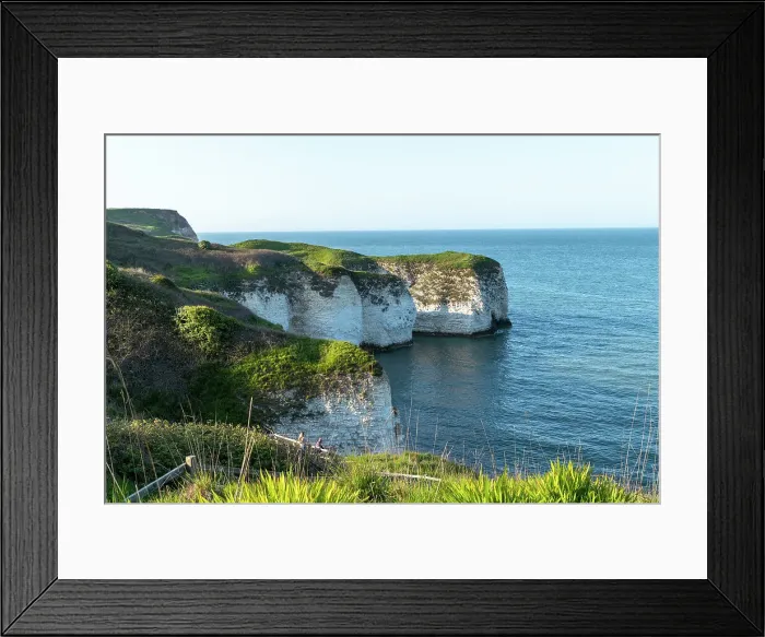 Framed Print : Scenic view of white chalk cliffs with lush greenery overlooking a calm blue sea, Flamborough, Yorkshire, England, United Kingdom, Europe Framed Print : Scenic view of white chalk cliffs with lush greenery overlooking a calm blue sea, Flamborough, Yorkshire, England, United Kingdom, Europe