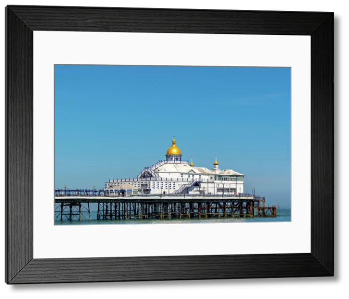 Framed Print : Victorian pier with a golden dome against a clear blue sky, symbolizing classic British seaside architecture, Eastbourne, East Sussex, England, United Kingdom, Europe Framed Print : Victorian pier with a golden dome against a clear blue sky, symbolizing classic British seaside architecture, Eastbourne, East Sussex, England, United Kingdom, Europe