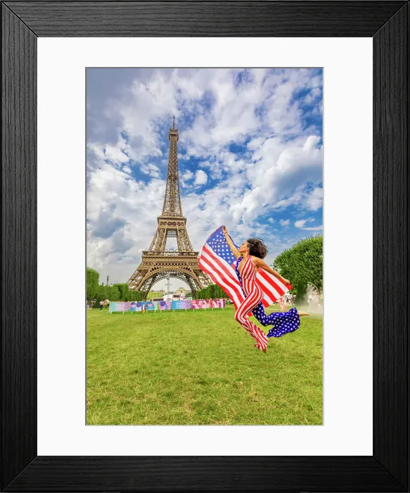 Framed Print : Patriotic American Woman jumping and cheering for Team USA and the Paris 2024 Olympics in front of the Eiffel Tower beach volleyball stadium, Paris, France, Europe