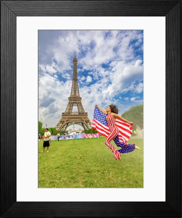 Framed Print : Patriotic American Woman jumping and cheering for Team USA and the Paris 2024 Olympics in front of the Eiffel Tower beach volleyball stadium, Paris, France, Europe Framed Print : Patriotic American Woman jumping and cheering for Team USA and the Paris 2024 Olympics in front of the Eiffel Tower beach volleyball stadium, Paris, France, Europe