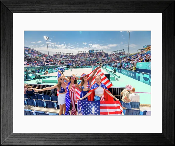 Framed Print : Patriotic American Woman jumping and cheering for Team USA and the Paris 2024 Olympics in front of the Eiffel Tower beach volleyball stadium, Paris, France, Europe Framed Print : Patriotic American Woman jumping and cheering for Team USA and the Paris 2024 Olympics in front of the Eiffel Tower beach volleyball stadium, Paris, France, Europe