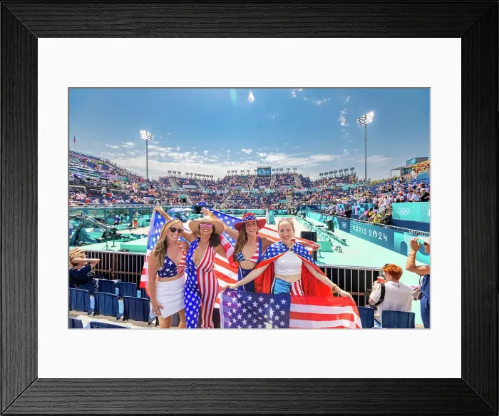 Framed Print : Patriotic American Woman jumping and cheering for Team USA and the Paris 2024 Olympics in front of the Eiffel Tower beach volleyball stadium, Paris, France, Europe Framed Print : Patriotic American Woman jumping and cheering for Team USA and the Paris 2024 Olympics in front of the Eiffel Tower beach volleyball stadium, Paris, France, Europe